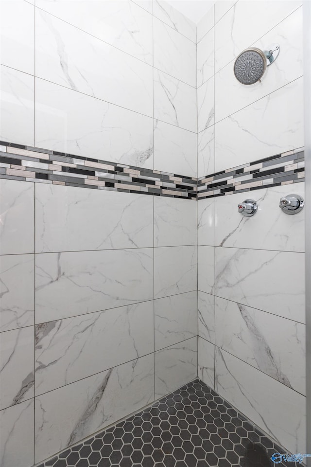 bathroom with a tile shower