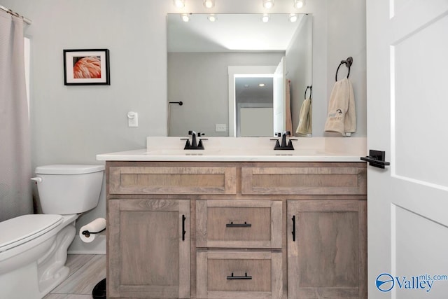 6305 Loring Loop NW, Huntsville, AL 35806 - bathroom with toilet, double vanity, and a sink