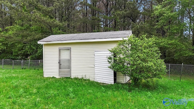 view of shed with fence
