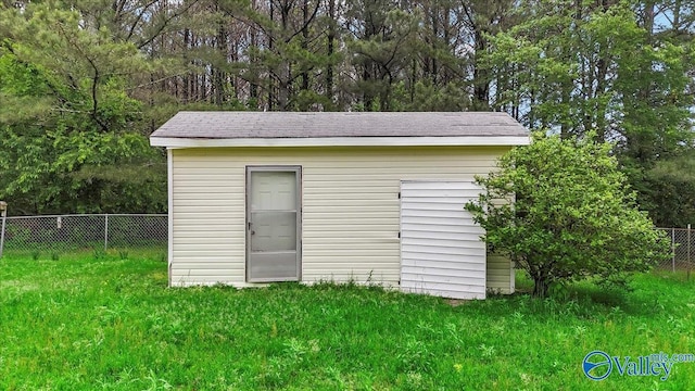 view of shed with fence
