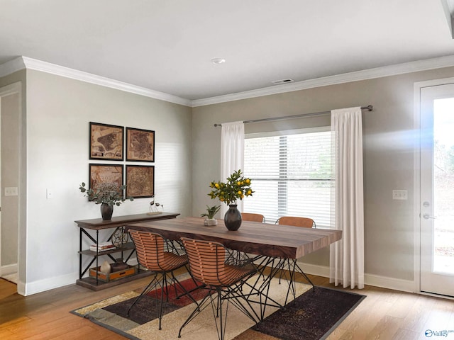 208 Fallow Cir, Madison, AL 35757 - dining area featuring light wood-style floors, healthy amount of natural light, and crown molding