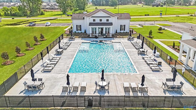 208 Fallow Cir, Madison, AL 35757 - community pool with french doors, a patio area, and a storage structure