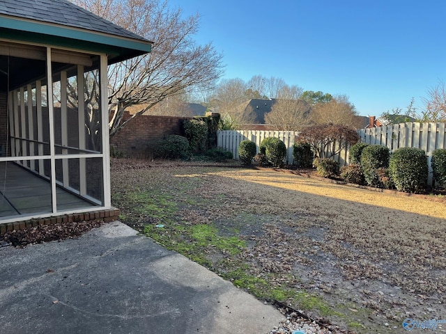 view of yard with a sunroom