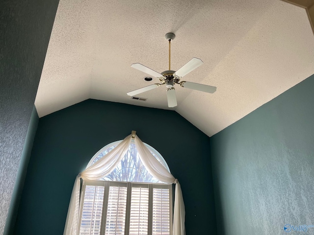 interior details with a textured ceiling and ceiling fan