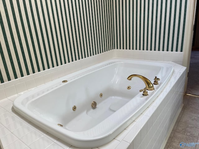 bathroom featuring tile patterned floors and tiled tub