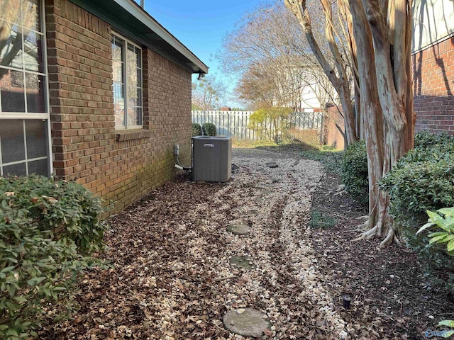 view of yard with central AC unit