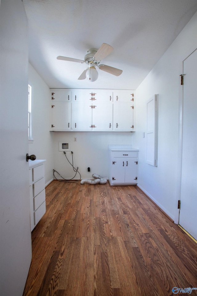 washroom featuring washer hookup, cabinet space, dark wood-type flooring, hookup for an electric dryer, and ceiling fan