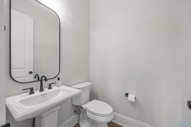 bathroom with sink and toilet