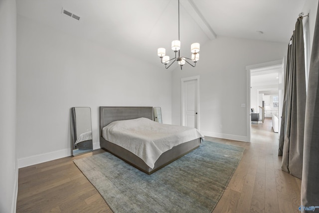 bedroom with hardwood / wood-style flooring, an inviting chandelier, and vaulted ceiling with beams