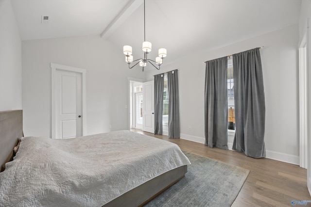 bedroom with wood-type flooring, lofted ceiling with beams, and a chandelier