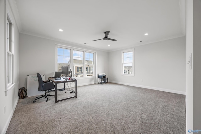 carpeted office space with crown molding and ceiling fan