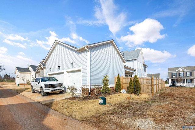 view of side of home featuring a garage