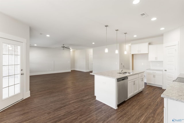 kitchen featuring visible vents, dark wood-type flooring, white cabinets, a sink, and dishwasher