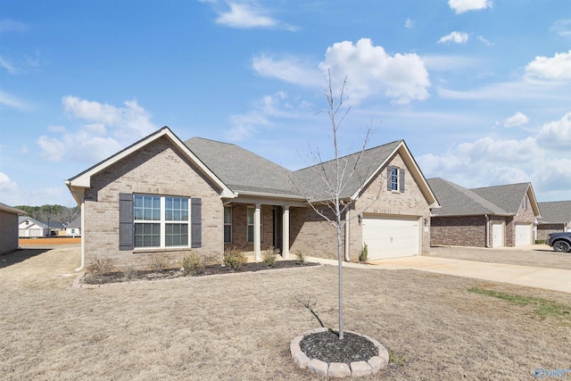 view of front of property with concrete driveway, brick siding, and a shingled roof