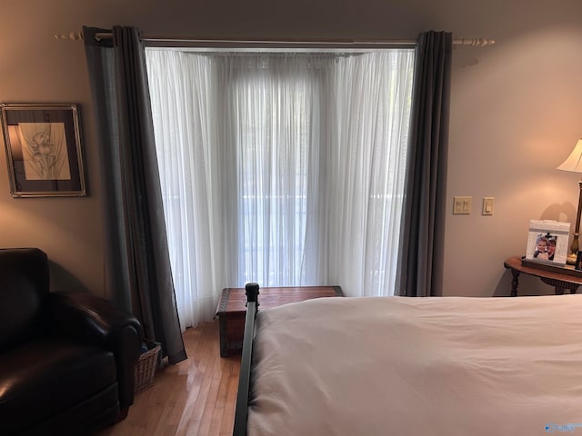 bedroom featuring wood-type flooring