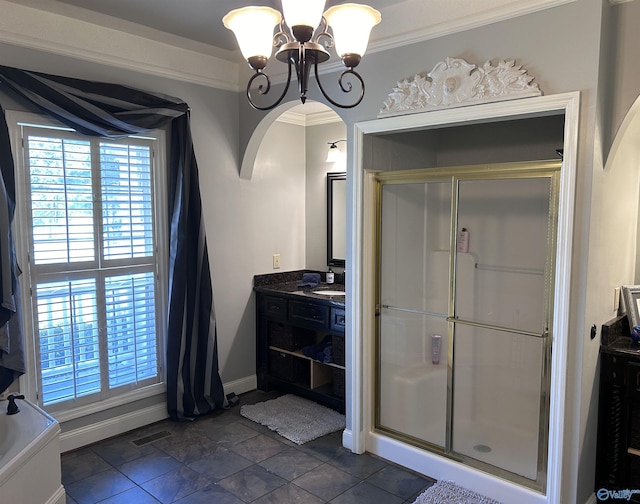 bathroom with a shower with door, a chandelier, crown molding, and vanity