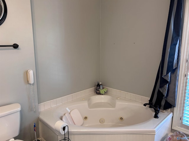 bathroom with a bathtub and toilet