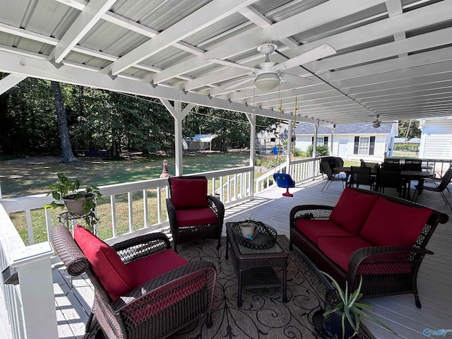 view of patio featuring ceiling fan, an outdoor living space, and a deck