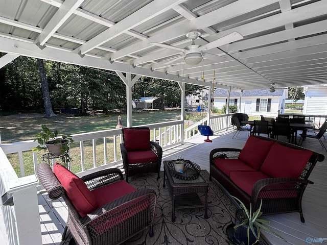 deck featuring a lawn, an outdoor hangout area, outdoor dining area, and ceiling fan