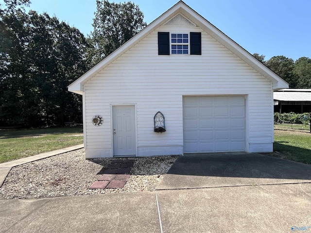 garage with concrete driveway