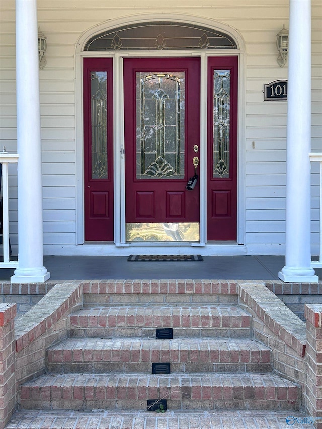 doorway to property featuring covered porch