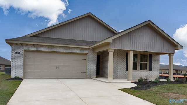 view of front of house with cooling unit and a garage