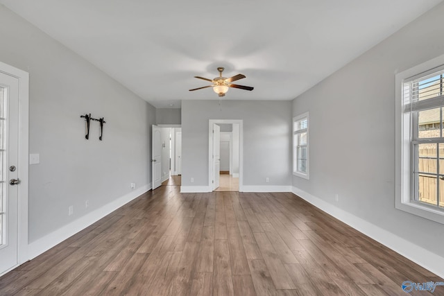 interior space featuring hardwood / wood-style floors and ceiling fan