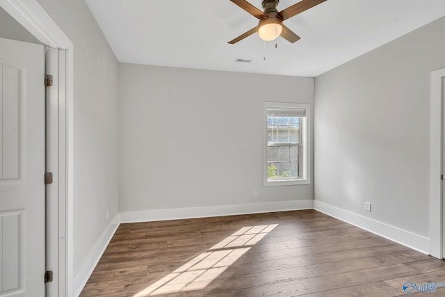 empty room featuring hardwood / wood-style flooring and ceiling fan