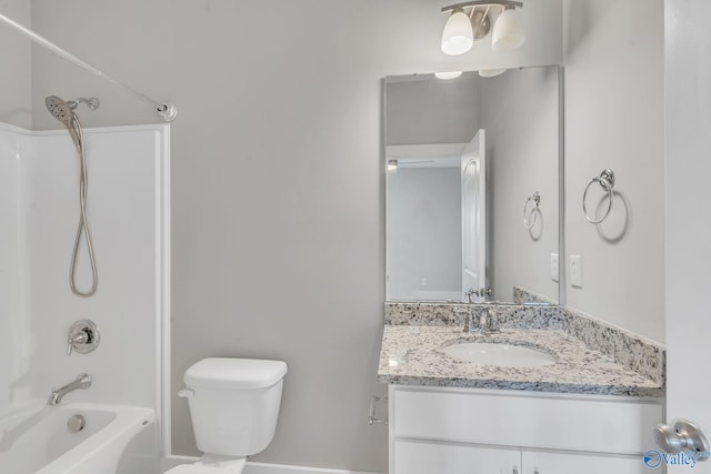 full bathroom featuring bathtub / shower combination, vanity, and toilet