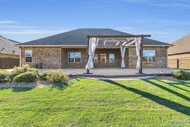 back of property featuring a yard and a patio area