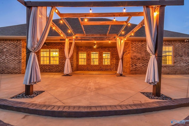 view of patio terrace at dusk