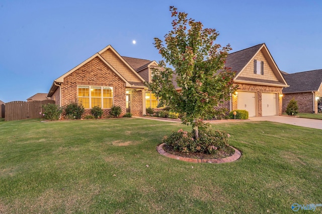 view of front of property with a garage and a front lawn