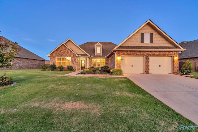 craftsman-style house with a garage and a lawn