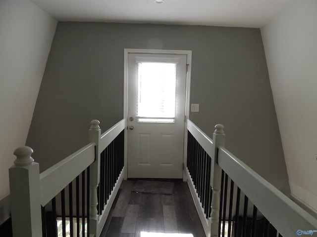 interior space with plenty of natural light and dark wood-style floors
