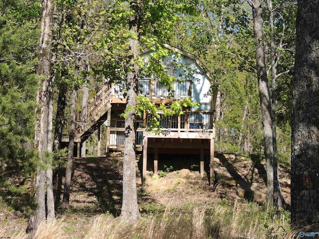 back of house with stairway and a deck