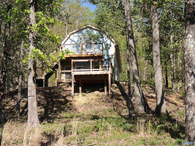 back of house featuring a deck