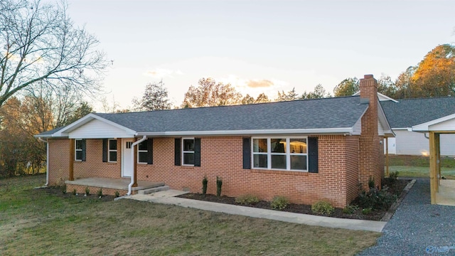 ranch-style house with a yard