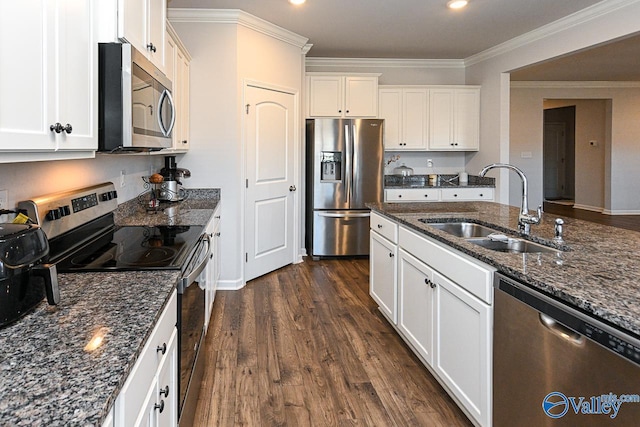 kitchen featuring sink, stainless steel appliances, dark hardwood / wood-style flooring, crown molding, and white cabinets