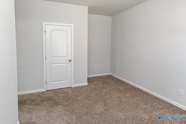 unfurnished room featuring carpet