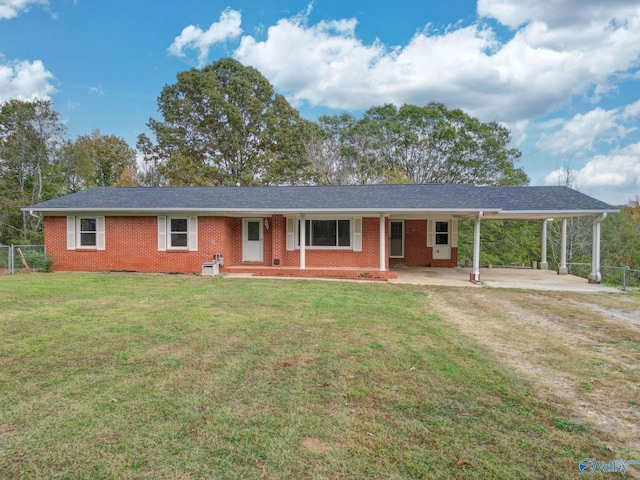 single story home featuring a carport and a front yard