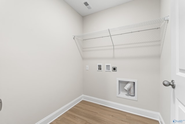 laundry room featuring laundry area, hookup for a washing machine, baseboards, and hookup for an electric dryer