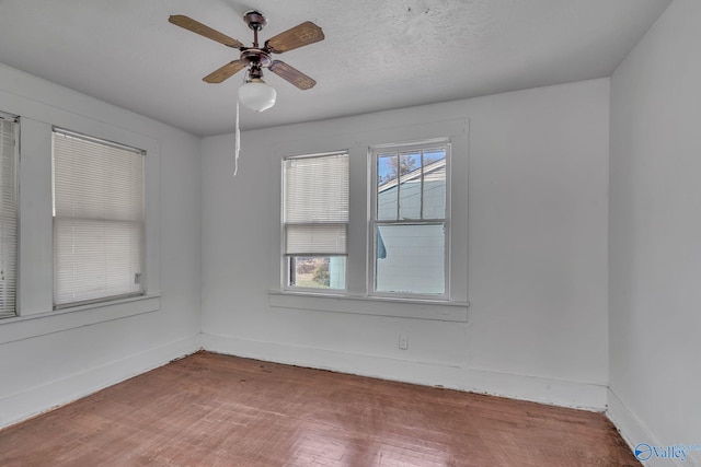 1011 Hermosa Ave, Gadsden, AL 35901 - spare room featuring baseboards, wood finished floors, and a ceiling fan