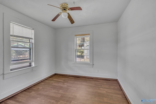 1011 Hermosa Ave, Gadsden, AL 35901 - empty room with wood finished floors, ceiling fan, and baseboards