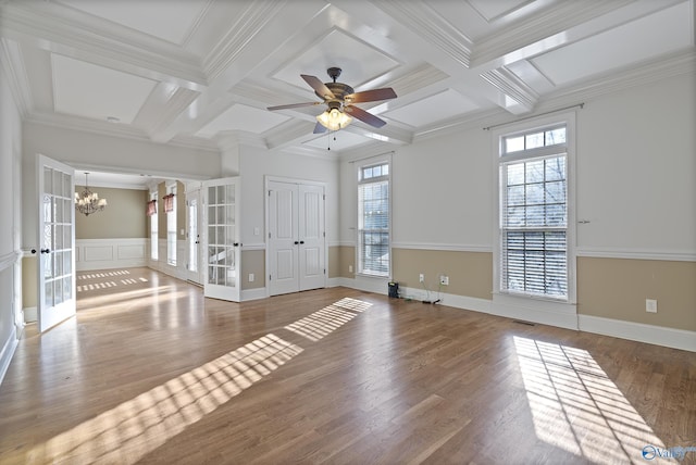 interior space featuring beam ceiling, coffered ceiling, wood finished floors, and french doors