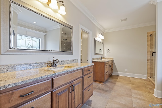 full bath with a shower stall, ornamental molding, and a sink