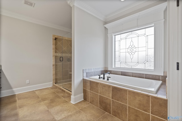 bathroom with visible vents, ornamental molding, a shower stall, baseboards, and a bath