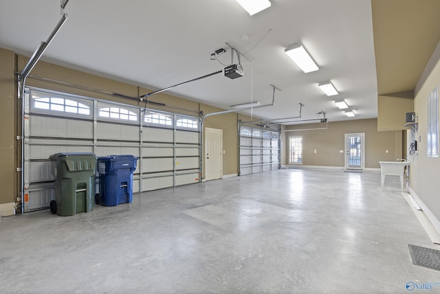 garage featuring baseboards and a garage door opener