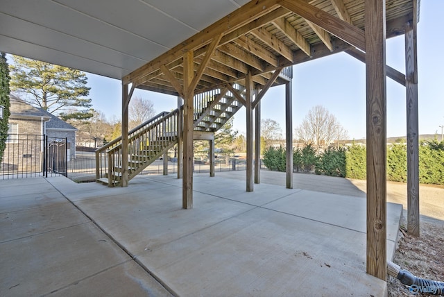 view of patio / terrace with stairs and fence