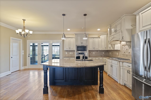 kitchen featuring appliances with stainless steel finishes, ornamental molding, light stone counters, and tasteful backsplash