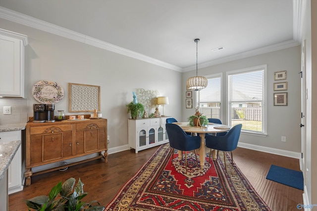 dining room with crown molding, visible vents, baseboards, and dark wood finished floors